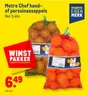 Metro Chef hand- of perssinaasappels